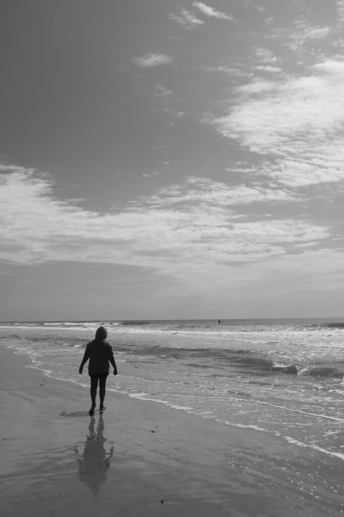 Mom walking on the beach, so beautiful